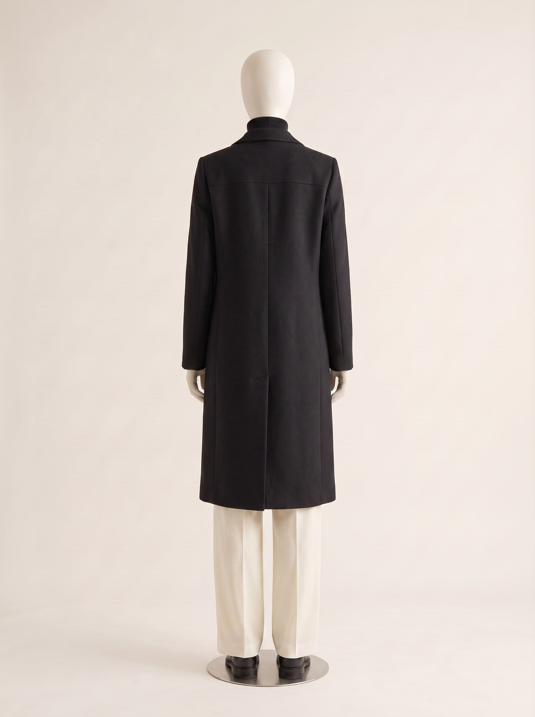 Consort, back view of a custom wool coat by Kroja